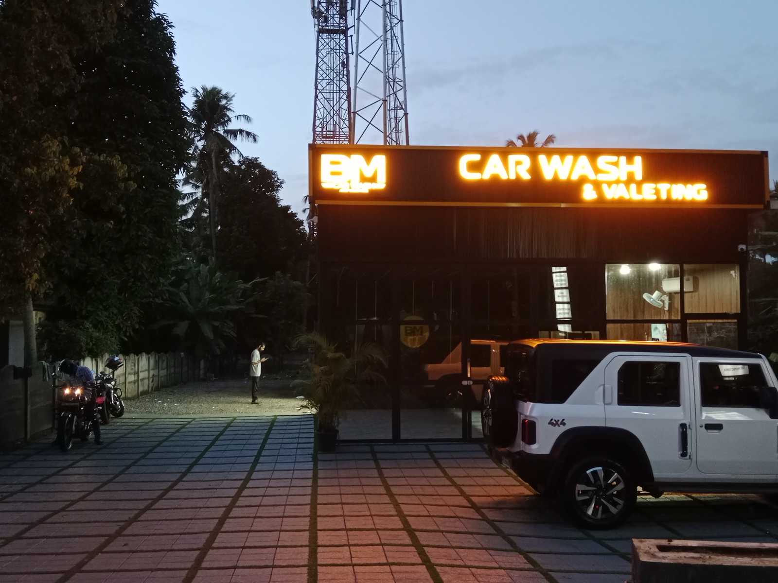 BM Car Wash & Valeting facility illuminated in the evening